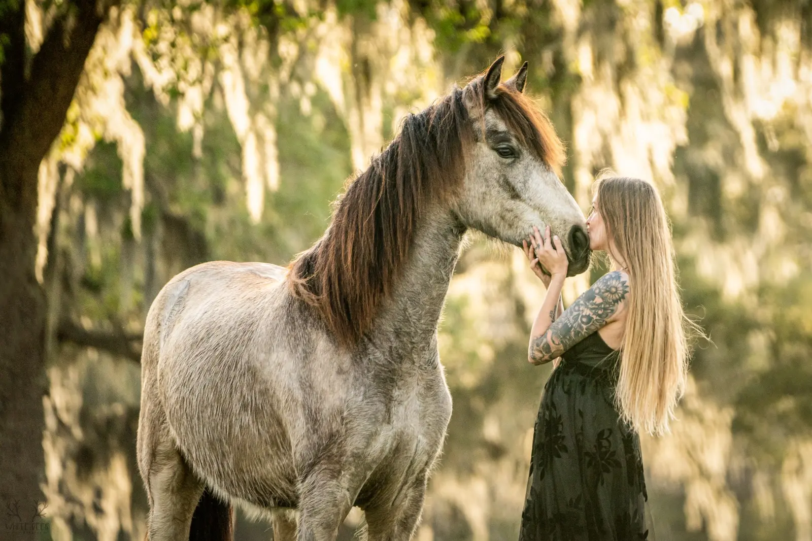 A woman sharing a quiet moment with her horse